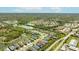 Scenic aerial view shows property's location near community, pond, and green spaces at 7012 White Willow Ct, Sarasota, FL 34243