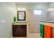 Bathroom featuring a granite-topped vanity and tiled walk-in shower at 7012 White Willow Ct, Sarasota, FL 34243