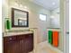 Bathroom featuring a granite-topped vanity and tiled walk-in shower at 7012 White Willow Ct, Sarasota, FL 34243