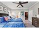 Bedroom with a ceiling fan, walk-in closet, and ensuite bathroom at 7012 White Willow Ct, Sarasota, FL 34243