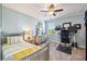 Bright bedroom with a bed, a work desk, and plenty of natural light at 7012 White Willow Ct, Sarasota, FL 34243