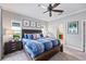 Bedroom with ceiling fan, bedside tables and access to the ensuite bathroom at 7012 White Willow Ct, Sarasota, FL 34243