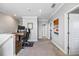 Upstairs hallway featuring an office space with a large desk and neutral carpeting at 7012 White Willow Ct, Sarasota, FL 34243