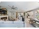 Spacious open-concept living area with kitchen, dining, and living spaces in a cohesive layout at 7012 White Willow Ct, Sarasota, FL 34243