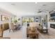 Spacious living room with large windows, fireplace, and an open floor plan perfect for Gathering gatherings at 7012 White Willow Ct, Sarasota, FL 34243