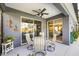Covered patio with stylish patio furniture and easy access to indoor spaces at 7012 White Willow Ct, Sarasota, FL 34243