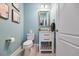 Charming powder room featuring modern fixtures, a stylish vanity, and fresh decor at 7012 White Willow Ct, Sarasota, FL 34243