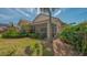 Enjoy outdoor living on this home's screened lanai surrounded by lush landscaping at 7133 Victoria Cir, University Park, FL 34201