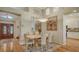 Elegant dining area featuring a chandelier and views into the kitchen at 7133 Victoria Cir, University Park, FL 34201
