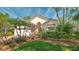 Charming home featuring a well-manicured lawn, lush landscaping, and beautiful curb appeal under a bright, sunny sky at 7133 Victoria Cir, University Park, FL 34201