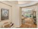 Elegant foyer with hardwood floors that flows into the living area, showcasing an open and inviting floor plan at 7133 Victoria Cir, University Park, FL 34201