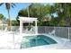 The community hot tub features a trellis and lounge chairs at 7133 Victoria Cir, University Park, FL 34201