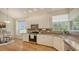 Bright kitchen with granite countertops, stainless appliances, and hardwood floors at 7133 Victoria Cir, University Park, FL 34201