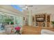 Spacious living room featuring a built-in entertainment center and access to the lanai at 7133 Victoria Cir, University Park, FL 34201