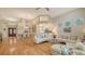 Open-concept living and dining area with lots of natural light and hardwood floors at 7133 Victoria Cir, University Park, FL 34201