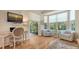 Cozy living room featuring a work station with a desk, stylish seating, and natural light, perfect for relaxation at 7133 Victoria Cir, University Park, FL 34201