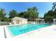 Great community pool view features clear blue water and plenty of poolside seating at 7133 Victoria Cir, University Park, FL 34201