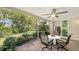 A screened lanai offers a relaxing outdoor space with views of mature trees at 7133 Victoria Cir, University Park, FL 34201