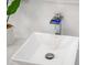 Close up of modern bathroom faucet with waterfall feature and unique design at 730 Rellim Ln, Sarasota, FL 34232