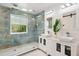 Modern bathroom features a spacious glass shower, double vanity, and stylish tile work at 730 Rellim Ln, Sarasota, FL 34232