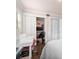 Comfortable bedroom with closet space, work area and hardwood flooring at 730 Rellim Ln, Sarasota, FL 34232
