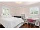 Cozy bedroom with natural light from windows, showcasing a comfortable and inviting space at 730 Rellim Ln, Sarasota, FL 34232