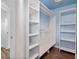 Bright walk-in closet featuring built-in shelving and ample storage space, perfect for organization at 730 Rellim Ln, Sarasota, FL 34232