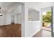 Bright foyer with hardwood floors and an open layout at 730 Rellim Ln, Sarasota, FL 34232