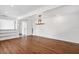 Spacious living room with wood floors, and recessed lighting offer a clean, modern aesthetic at 730 Rellim Ln, Sarasota, FL 34232