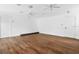 Spacious living room with ceiling fans and hardwood floors at 730 Rellim Ln, Sarasota, FL 34232