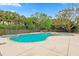 Beautifully landscaped backyard pool with spa and patio seating offers a great space to relax and entertain at 730 Rellim Ln, Sarasota, FL 34232