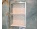 Close-up of shower caddy with attractive tile in modern luxury bathroom at 730 Rellim Ln, Sarasota, FL 34232