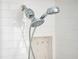 Close up of the modern shower head with subway tile surround and a soap/shampoo niche at 730 Rellim Ln, Sarasota, FL 34232