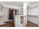 Spacious walk-in closet with custom shelving, drawers, and ample hanging space for organized storage at 730 Rellim Ln, Sarasota, FL 34232