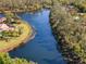 Aerial view showcases a serene waterfront community at 7300 Wax Myrtle Way, Sarasota, FL 34241