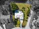 Aerial view of the property, showcasing the home's layout, pool, and spacious lot at 7300 Wax Myrtle Way, Sarasota, FL 34241