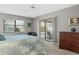 Comfortable bedroom with natural light, sliding glass doors and a peaceful ambiance at 7300 Wax Myrtle Way, Sarasota, FL 34241