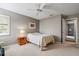 The neutral bedroom features a ceiling fan, and an exit to the rest of the home at 7300 Wax Myrtle Way, Sarasota, FL 34241