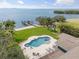 Stunning aerial view of backyard oasis, featuring pool, personal dock, and waterfront access at 7330 Westmoreland Dr, Sarasota, FL 34243