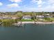 Waterfront property with private dock, home, and manicured lawn at 7330 Westmoreland Dr, Sarasota, FL 34243