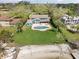 Beautiful home with pool and direct access to a private beach on a manicured lawn at 7330 Westmoreland Dr, Sarasota, FL 34243