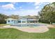 Stunning backyard with a sparkling pool, lush landscaping, and waterfront views at 7330 Westmoreland Dr, Sarasota, FL 34243