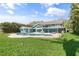 Expansive backyard with a pool, patio area, and lush greenery, perfect for entertaining at 7330 Westmoreland Dr, Sarasota, FL 34243