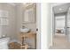 Charming half-bathroom with a unique vessel sink and decorative accents at 7330 Westmoreland Dr, Sarasota, FL 34243