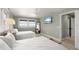Inviting bedroom featuring two beds, ample natural light, and a calming ambiance at 7330 Westmoreland Dr, Sarasota, FL 34243