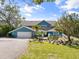 Charming home featuring a well-manicured lawn and a spacious driveway at 7330 Westmoreland Dr, Sarasota, FL 34243
