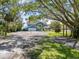 Beautiful waterfront home with an attached two-car garage and circular driveway at 7330 Westmoreland Dr, Sarasota, FL 34243