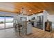 Beautiful kitchen featuring stainless steel appliances, a stone breakfast bar, and scenic views of the waterfront at 7330 Westmoreland Dr, Sarasota, FL 34243