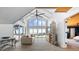 Bright living room with vaulted ceiling, ocean views, and sliding glass doors to outdoor space at 7330 Westmoreland Dr, Sarasota, FL 34243