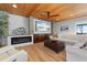 Inviting living room with a fireplace, wood-paneled ceilings, and stylish decor, perfect for relaxation and entertainment at 7330 Westmoreland Dr, Sarasota, FL 34243